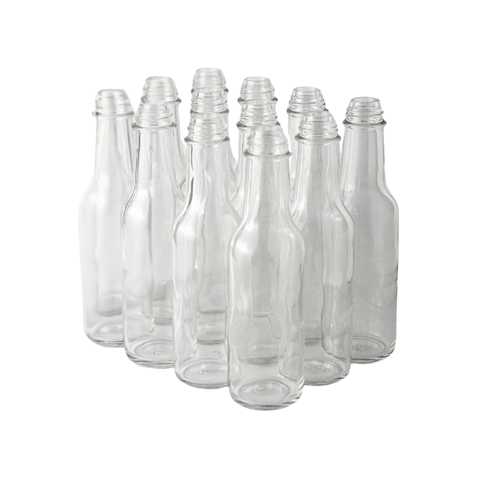 Set of 12 clear 5 oz Woozy bottles by FastBrewing, ideal for homebrewing and winemaking, shown with caps and labels.