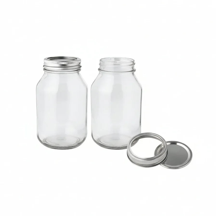 Two 32oz FastRack glass mason jars with metal lids, shown side by side, ideal for storage and canning.