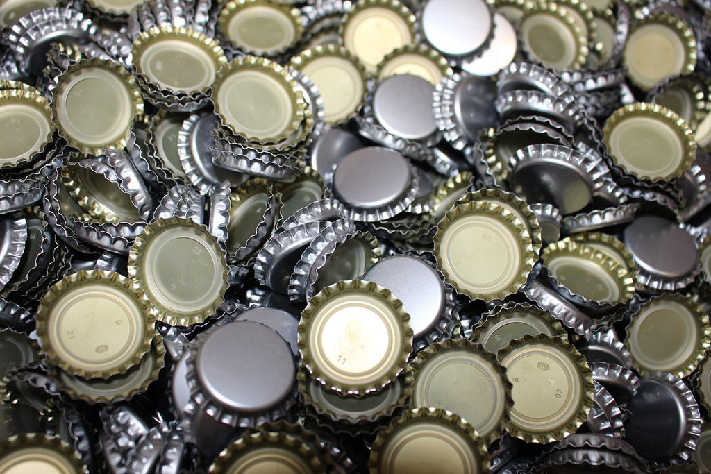 Silver oxygen absorbing beer bottle caps by FastRack, designed to preserve beer freshness and prevent oxidation.