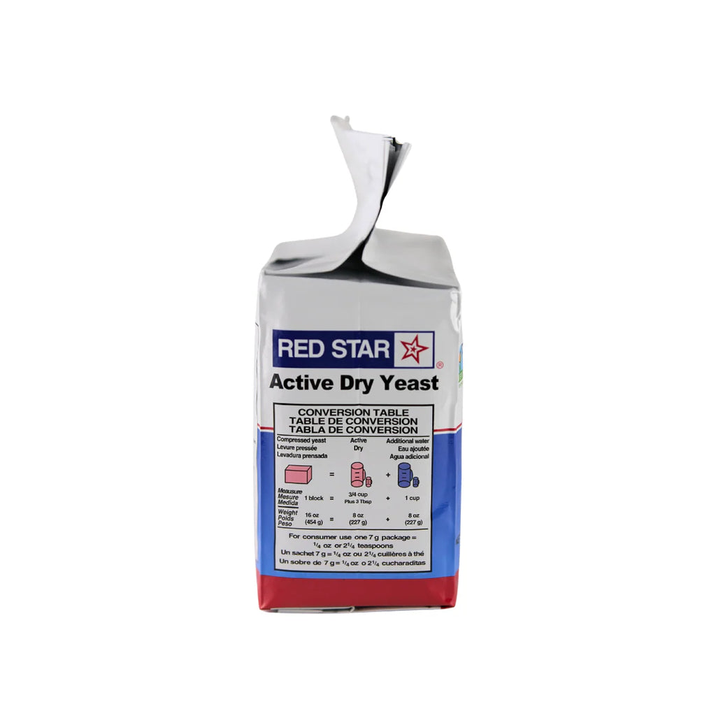 Red Star Active Dry Baking Yeast in a 2 lb package from FastRack, showing the yeast grains in a clear container.