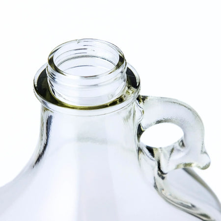Set of four 1-gallon glass fermentation jugs from FastRack, clear jugs with wide mouths for home brewing.