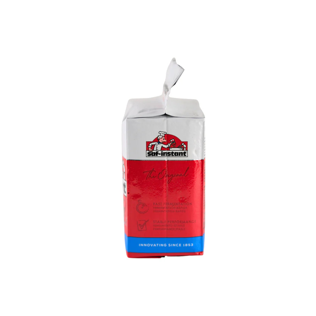 Red Star SAF Instant Baking Yeast in a red and white package, 1 lb, by FastRack, ready for baking bread and pastries.