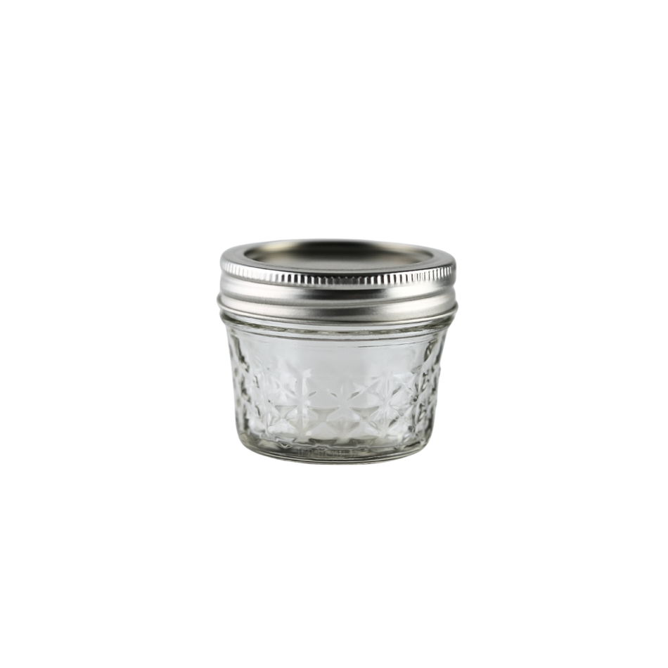 Set of 12 Ball Mason Jars 4 oz with quilted design, bands, and lids, ideal for homebrewing and preserving.