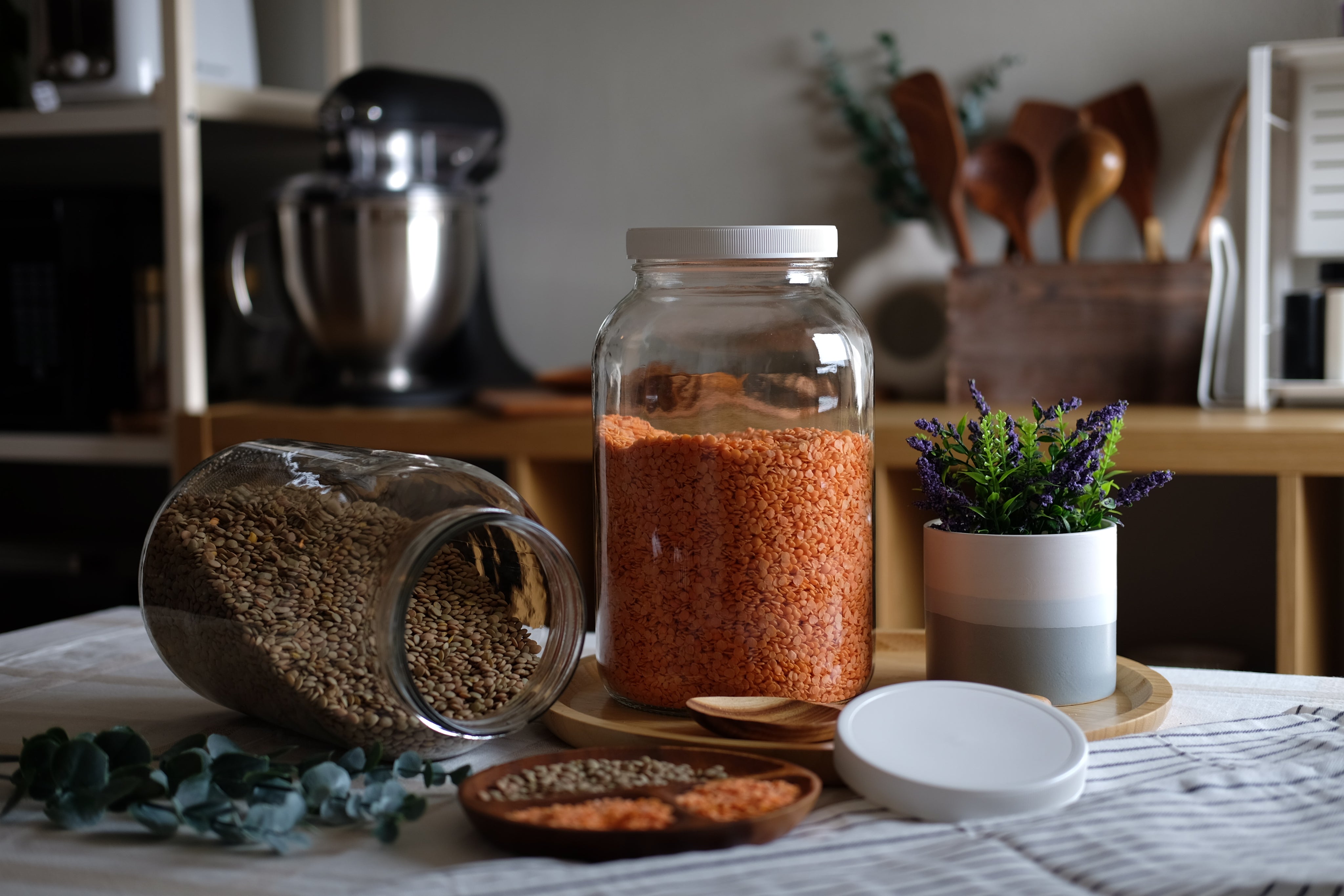 110mm plastic wide mouth jar lid for 1-gallon glass jars, compatible with FastRack jars, shown in close-up with a smooth surface.