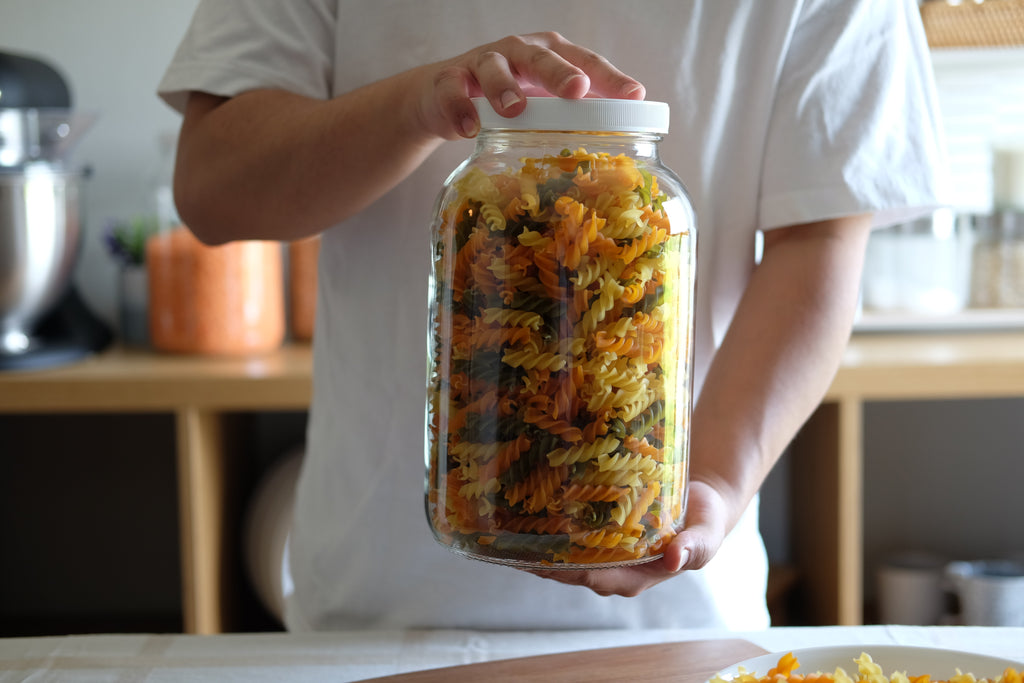 110mm plastic wide mouth jar lid for 1 gallon glass jars, compatible with FastRack jars, showing the lid's smooth surface and secure fit.